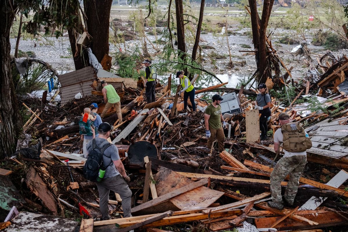  Search and rescue workers dig through debris looking for any survivors or remains of people swept up in the flash flooding on July 6, 2025 in Hunt, Texas. Heavy rainfall caused flooding along the Guadalupe River in central Texas with multiple fatalities reported. (Photo by Jim Vondruska/Getty Images)