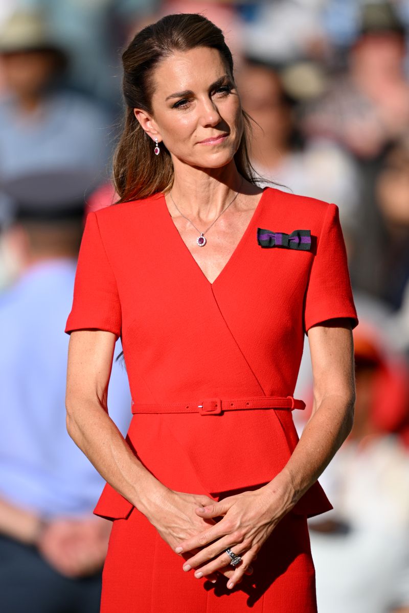 The Princess of Wales paired her red dress with nude heels, a taupe handbag, and ruby-and-diamond jewelry.