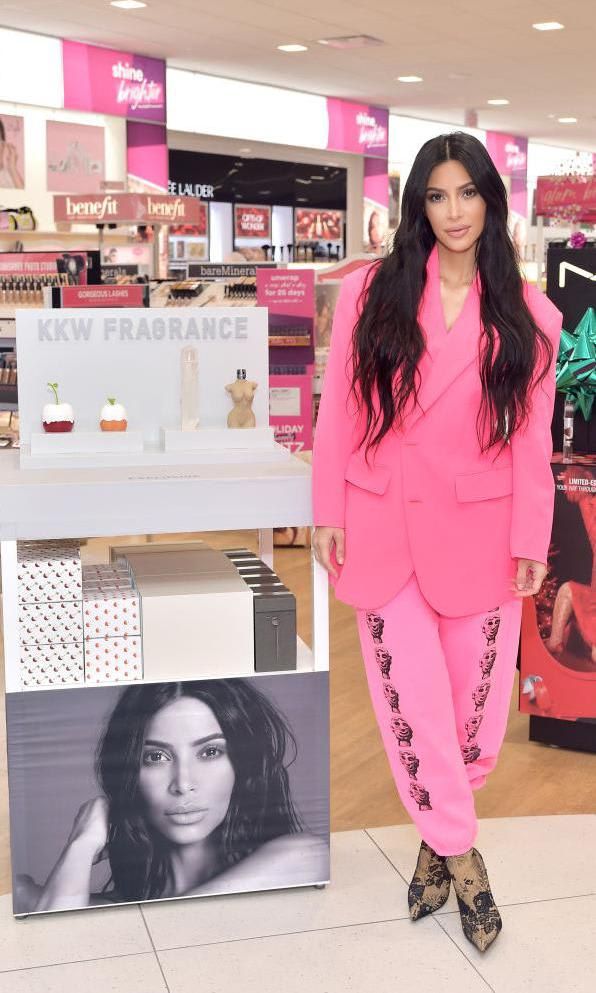 Kim Kardashian wearing an oversize pink blazer and tonal pants