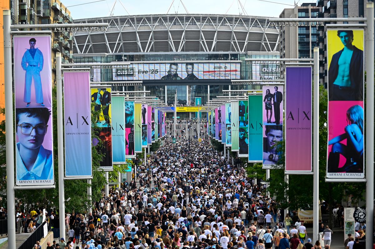 A general view of Oasis fans arriving at the Oasis Live '25 Tour at Wembley Stadium on July 25, 2025 in London, England.
