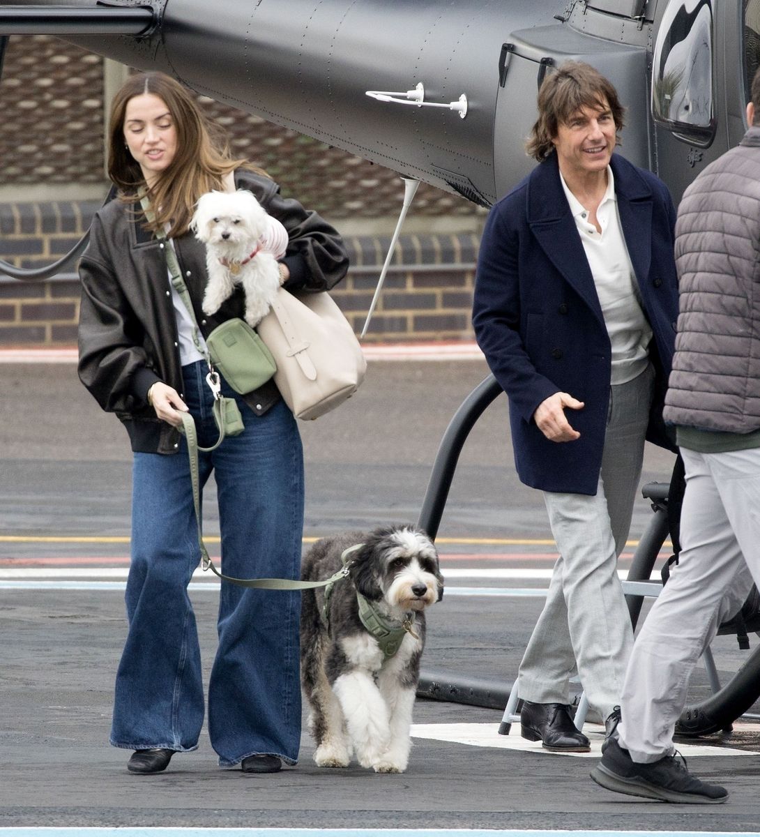 Ana de Armas and Tom Cruise deboarding a private helicopter in London