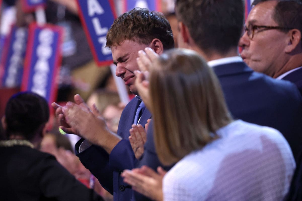 Democratic vice presidential nominee Minnesota Gov. Tim Walz's son Gus, back center, cries during the Democratic National Convention Wednesday, Aug. 21, 2024, in Chicago. (Robert Gauthier/Los Angeles Times via Getty Images)