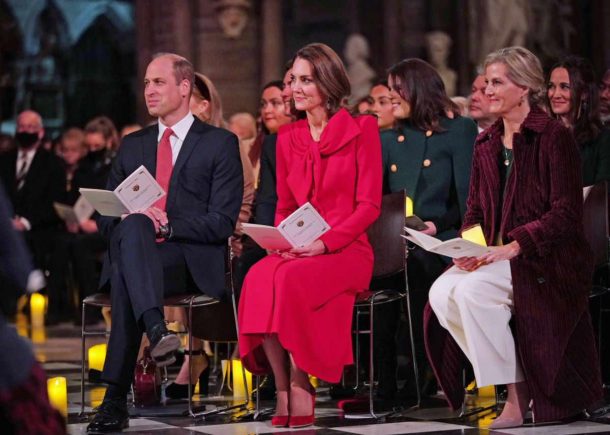 LONDON, ENGLAND - DECEMBER 08: Previously unissued photo dated 08/12/21 Prince William, Duke of Cambridge, Catherine, Duchess of Cambridge and Sophie, Countess of Wessex take part in 'Royal Carols - Together At Christmas', a Christmas carol concert hosted by the duchess at Westminster Abbey in London, which will be broadcast on Christmas Eve on ITV.  on December 8, 2021 in London, England. Led by the duchess, and supported by The Royal Foundation, the service was attended by those Kate and William had spent time with during recent engagements, as well as members of the armed forces involved in Operation Pitting, young carers, faith leaders and those who may have been more vulnerable or isolated during the pandemic.(Photo by Yui Mok - WPA Pool/Getty Images)