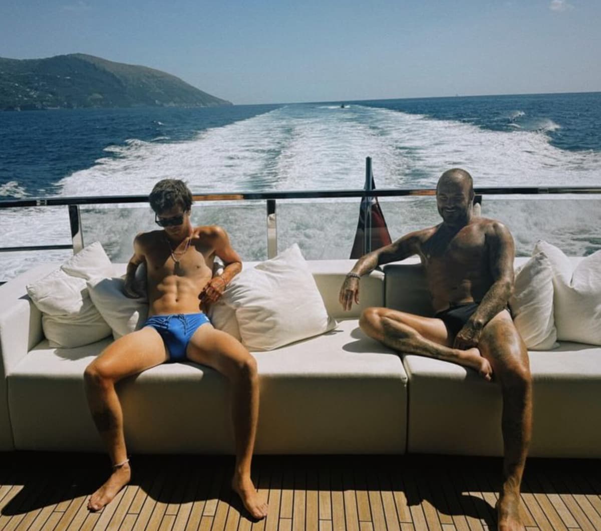 David and Cruz Beckham are all smiles in matching speedos.