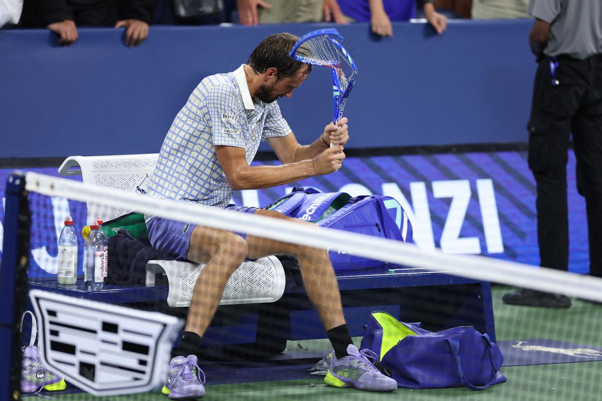 Russia's Daniil Medvedev breaks his racket after losing his men's singles first round tennis match against France's Benjamin Bonzi on day one of the US Open 
