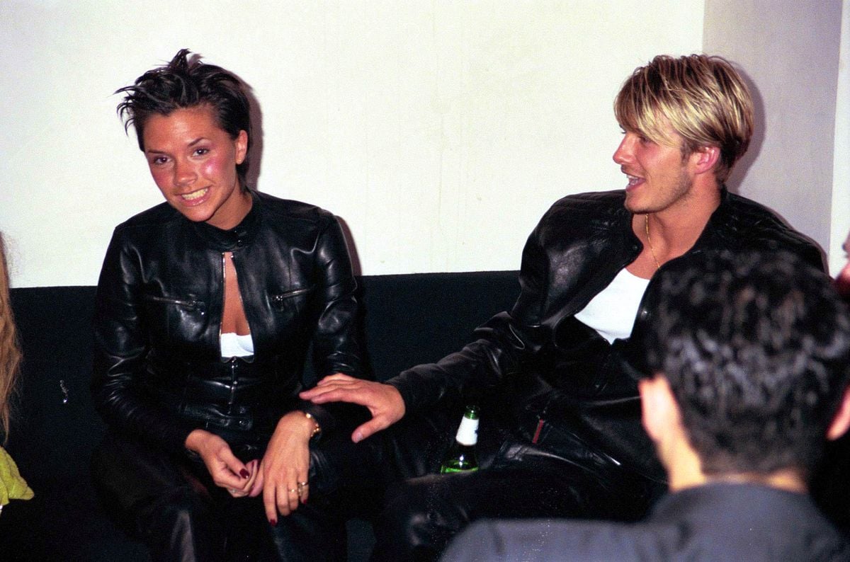 David Beckham and wife Victoria Beckham attend the Versace Store opening party in 1999