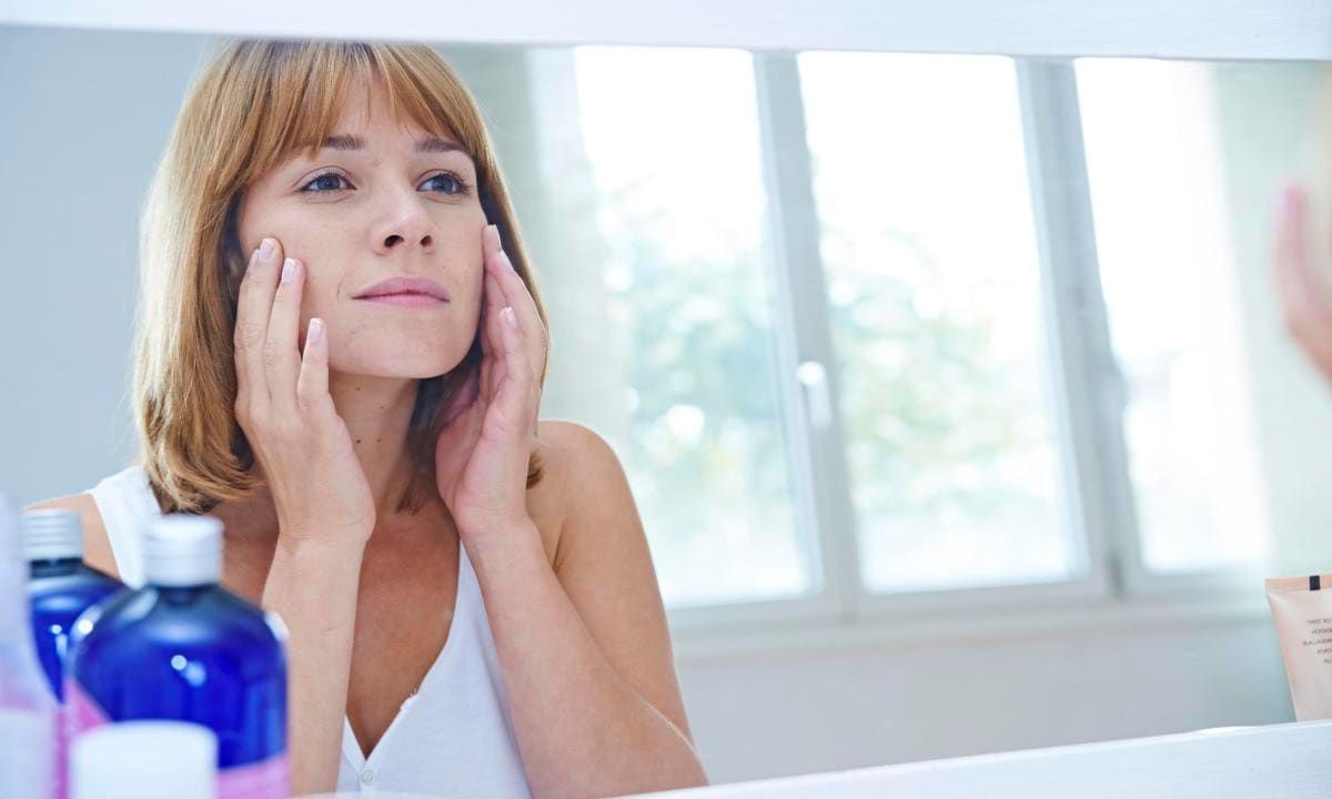 Woman looking in a mirror