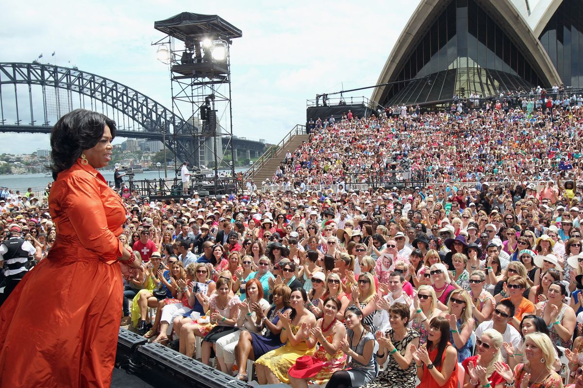 Oprah Winfrey speaks on stage during the first taping of the "Oprah Winfrey Show" at the Sydney Opera House on December 14, 2010, in Sydney, Australia