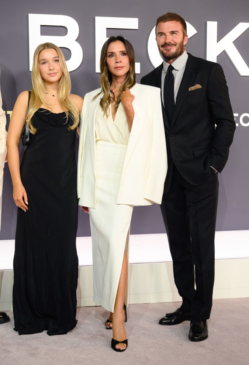 While Victoria opted for an all-cream ensemble from her own collection, Harper provided the perfect contrast in a sleek black gown.