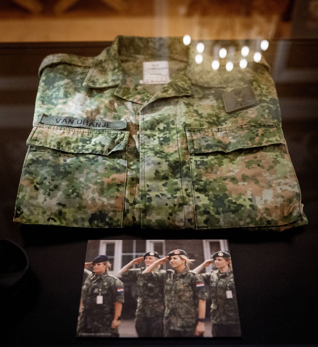 Queen Máxima's camouflage military uniform is on display at Noordeinde Palace as part of a special royal exhibition.