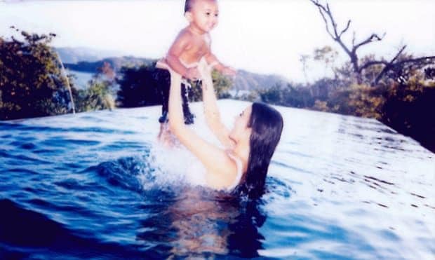 Kim gave her son Saint a lift in the pool during their vacation.
Photo: KimKardashianWest.com