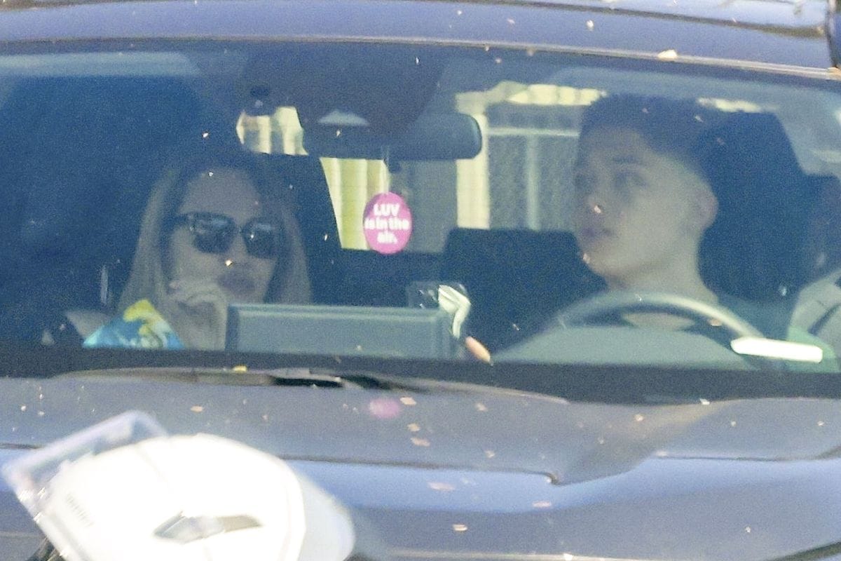 Knox Jolie Pitt driving alongside Angelina Jolie