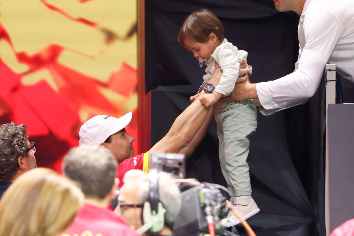 Rafael Nadal of Spain holds his son Rafael Nadal Junior after Carlos Alcaraz victory during the Davis Cup Finals quarterfinal.