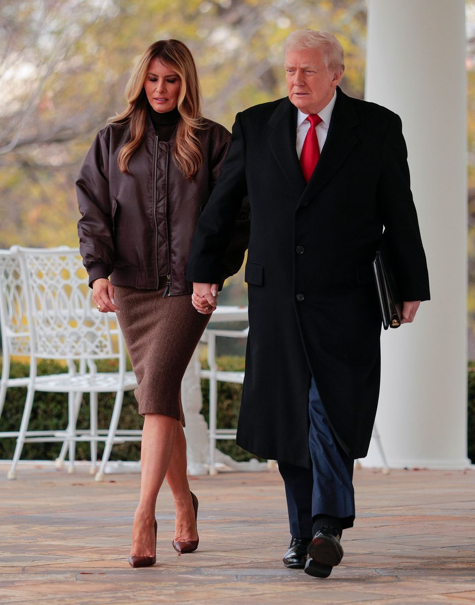 First lady Melania Trump in a chocolate-brown bomber jacket worn over a matching turtleneck and a fitted wool skirt.