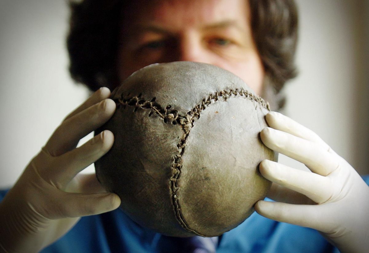 Michael McGinnes, curator at the Stirling Smith Art Gallery and Museum holds the oldest known football in the world.   