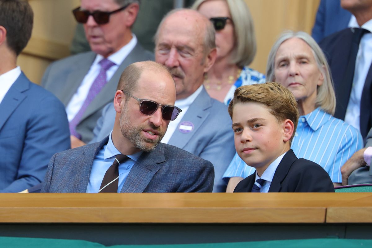 Prince William and Prince George shared a quiet conversation in the Royal Box as they watched the action unfold during the Wimbledon men's final