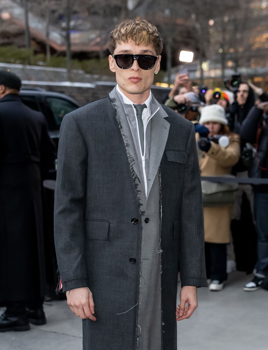Peso Pluma is seen arriving to the Thom Browne fashion show fashion show during New York Fashion Week on February 11, 2025 in New York City
