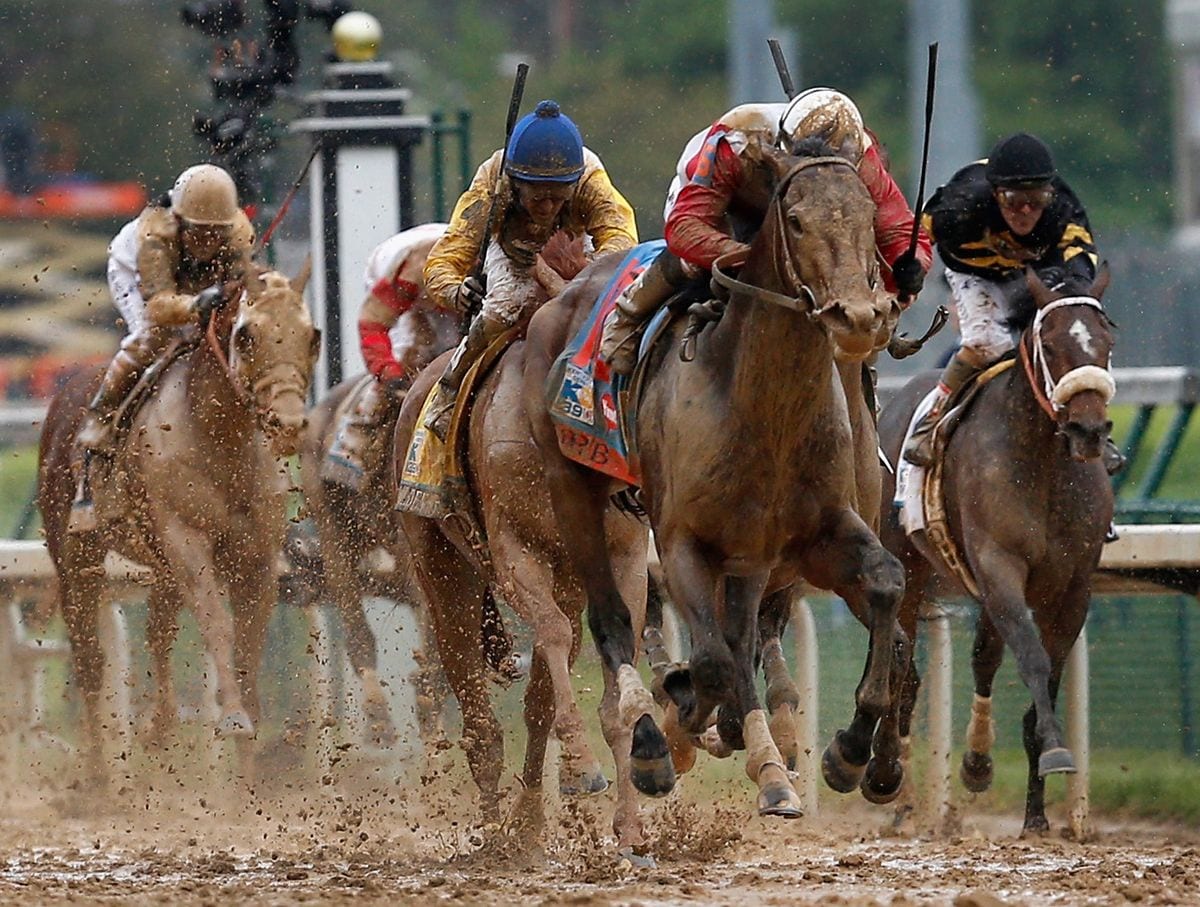 Jockey Joel Rosario guides Orb to the finish line to win the 139th running of the Kentucky Derby at Churchill Downs on May 4, 2013 in Louisville, Kentucky.