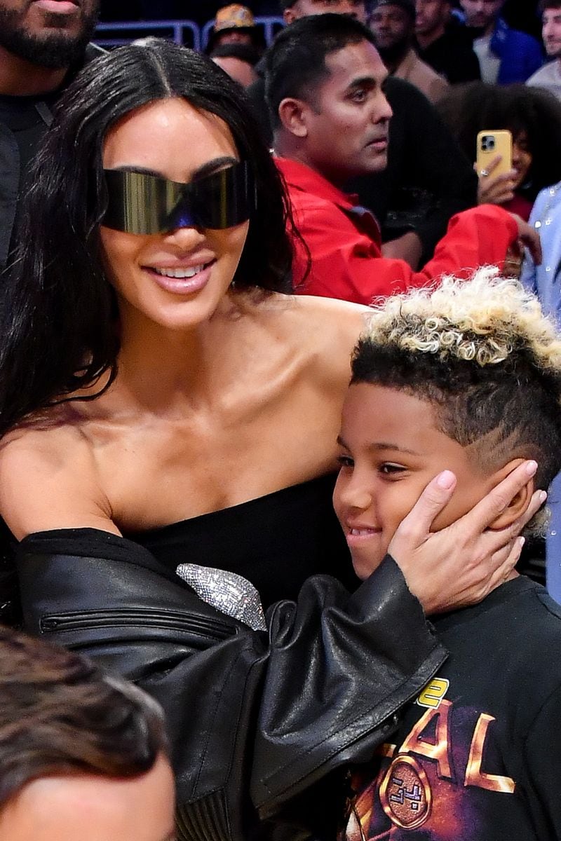 Kim Kardashian and Saint West attend a basketball game between the Los Angeles Lakers and the Phoenix Suns at Crypto.com Arena on December 05, 2023 in Los Angeles, California. 