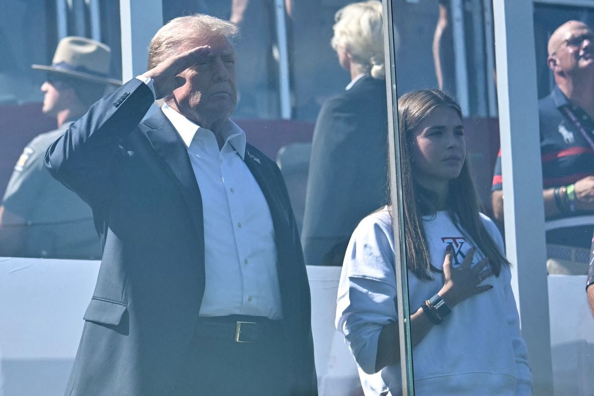 President Donald Trump and his grand daughter Kai Madison Trump listen to the national anthem during the 45th Ryder Cup golf competition at Bethpage Black Course 