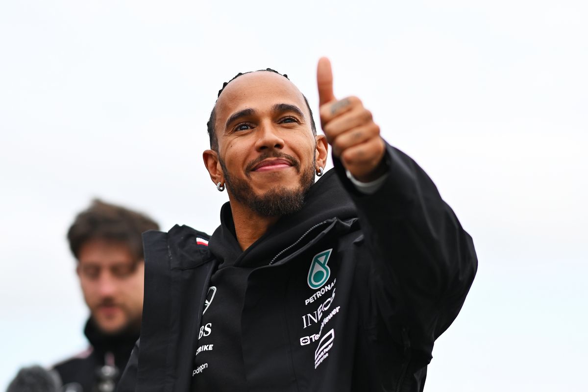  Lewis Hamilton of Great Britain and Mercedes wave to the crowd from the track during previews ahead of the F1 Grand Prix of Great Britain at Silverstone Circuit on July 04, 2024, in Northampton, England.