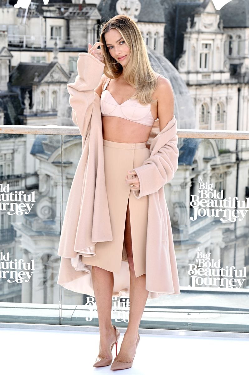 Margot Robbie posed in a powder pink archival ensemble from Thierry Mugler’s Fall 1998 'Lingerie' collection.