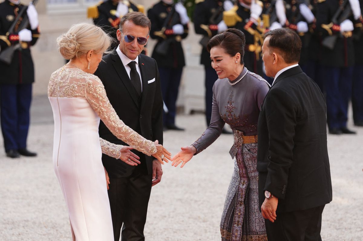 France's President Emmanuel Macron and his wife Brigitte Macron greet Thailand's King Maha Vajiralongkorn and Thailand's Queen Suthida