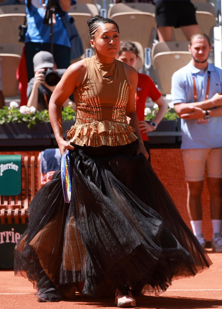 PARIS, FRANCE - MAY 26: Naomi Osaka of Japan enters the court wearing a custom Nike black dress ahead of her first round match against Laura Siegemund of Germany on day 3 of the 2026 French Open, Roland-Garros 2026, a Grand Slam tennis tournament at Stade Roland Garros on May 26, 2026 in Paris, France. (Photo by Jean Catuffe/Getty Images) 