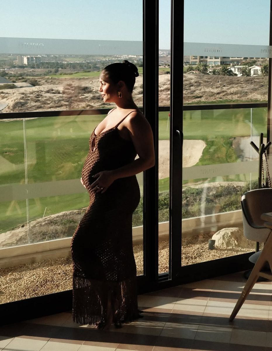 Vanessa Hudgens bares her baby bump in a sheer maternity dress
