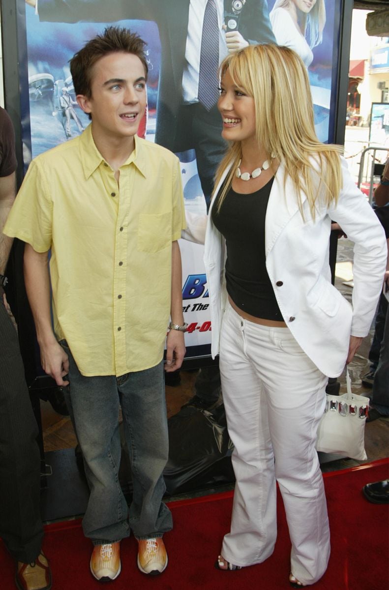 Actors Frankie Muniz and Hilary Duff arrive  arrive for the premiere of the film "Agent Cody Banks" at the Mann Village Theatre Westwood, on March 8, 2003, Westwood, California. (Photo Frazer by Harrison/Getty Images)