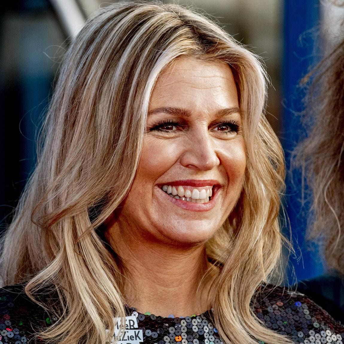 The Dutch royal parted her hair in the middle and styled her golden locks down in soft waves