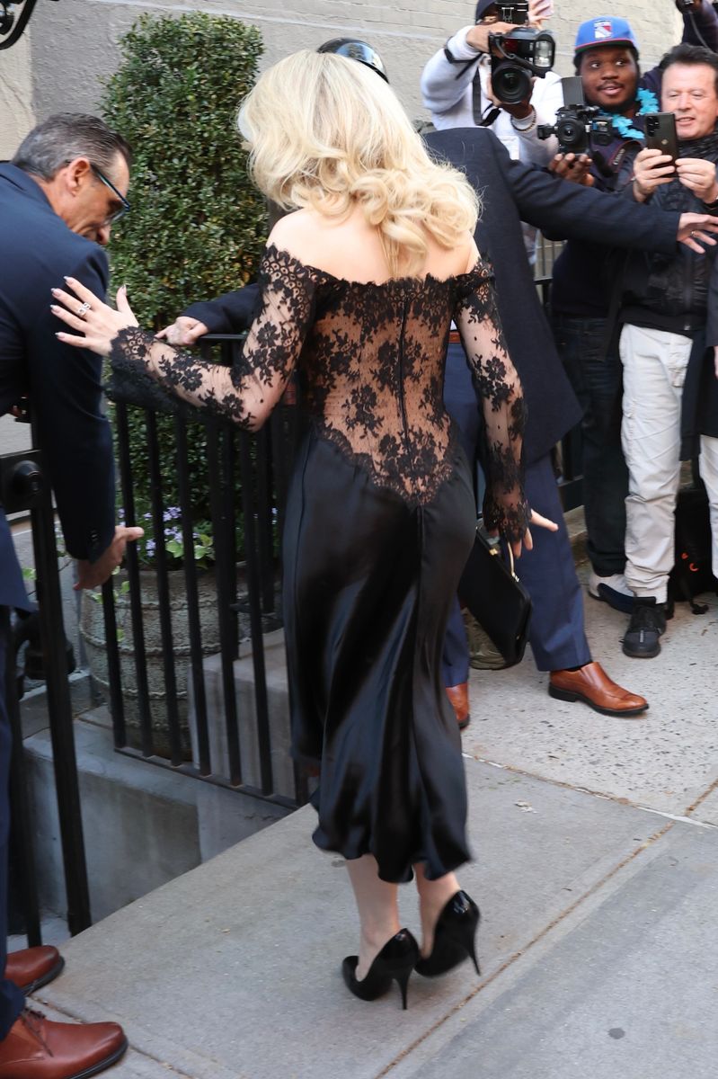 Sabrina Carpenter's dress revealed even more craftsmanship, with the lace cascading into the satin in a sculpted, corset-like pattern that accentuated the waist and added dimension. 
