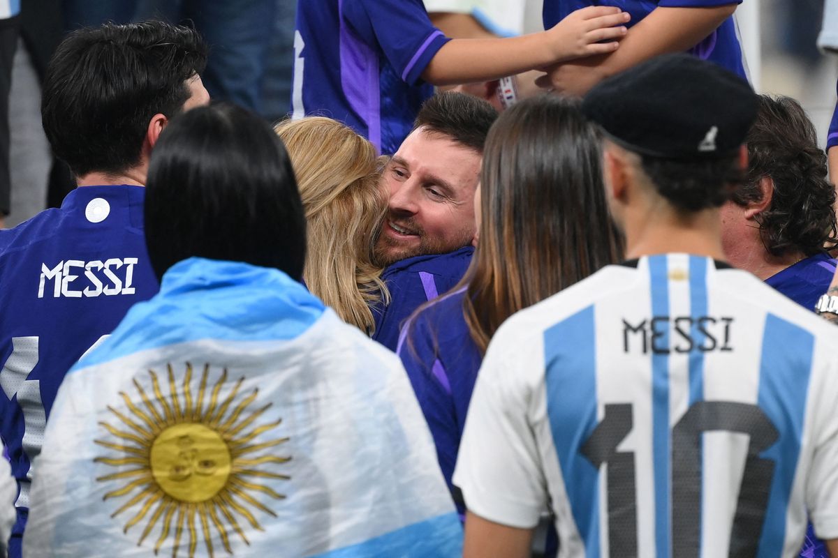 Lionel Messi is embraced by his mother Celia Maria Cuccittini as he celebrates after the awards ceremony after winning the Qatar 2022 World Cup 