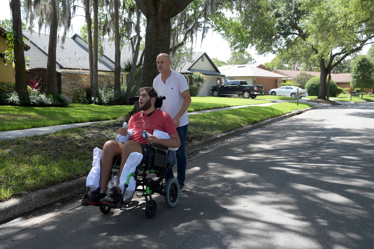 Former professional boxer Prichard Colon is taken for a stroll by his father Richard Colon