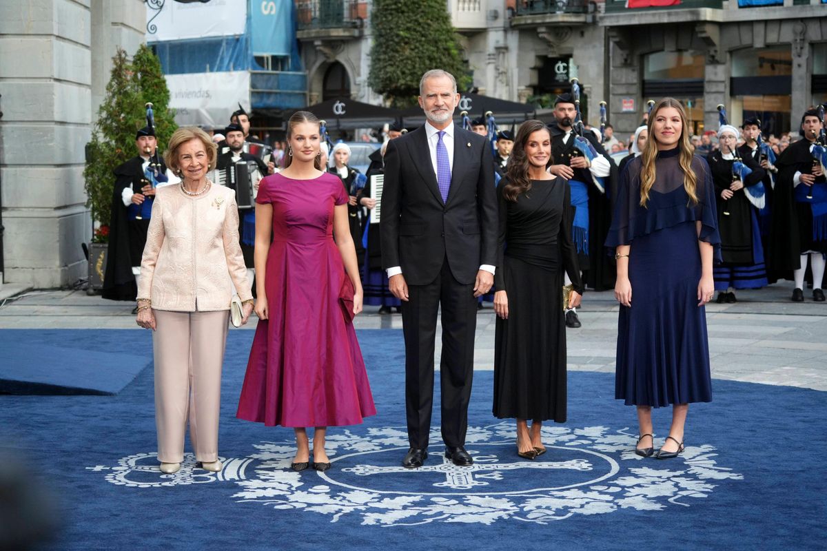 The future queen of Spain paired her elegant magenta midi dress with sparkling heels and a matching clutch, allowing her historic jewelry to take center stage.