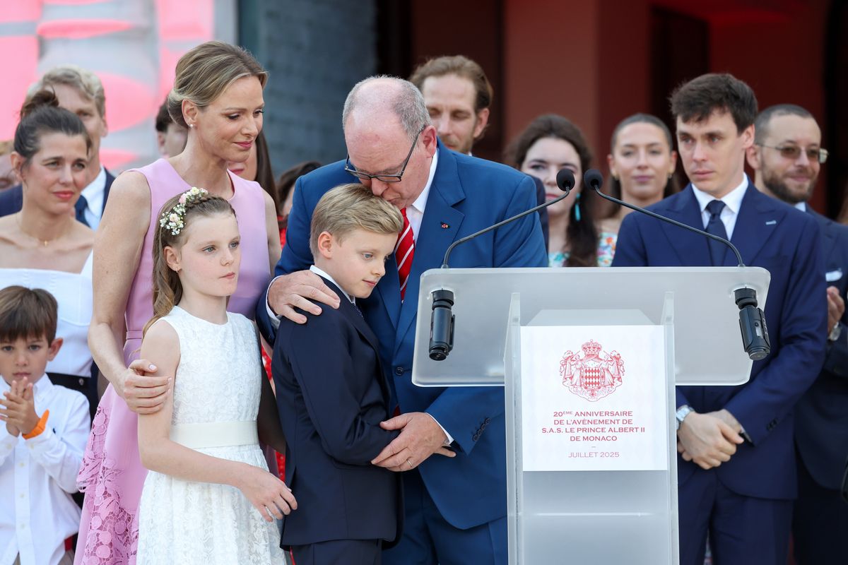 Princess Charlene of Monaco, Princess Gabriella of Monaco, Prince Jacques of Monaco and Prince Albert II of Monaco hug each other after Prince Albert II of Monaco