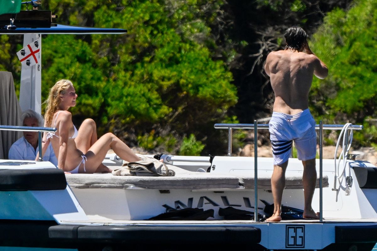 Gwyneth Paltrow and Brad Falchuk were guests aboard the yacht of Giancarlo Giammetti and spent time in a secluded cove off Caprera Island in the La Maddalena archipelago.