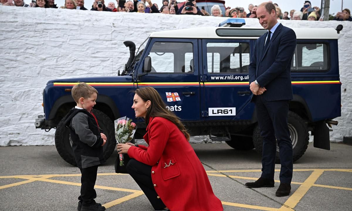 Theo presented the Princess with flowers. William joked to his private secretary, "He's got a smarter tie than you, J-C!"