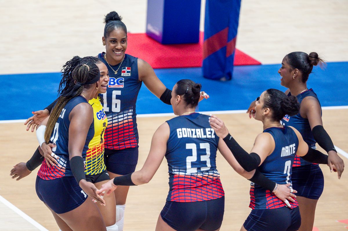 Players of team Dominican Republic celebrate after winning a point during the women's Volleyball Nations League match
