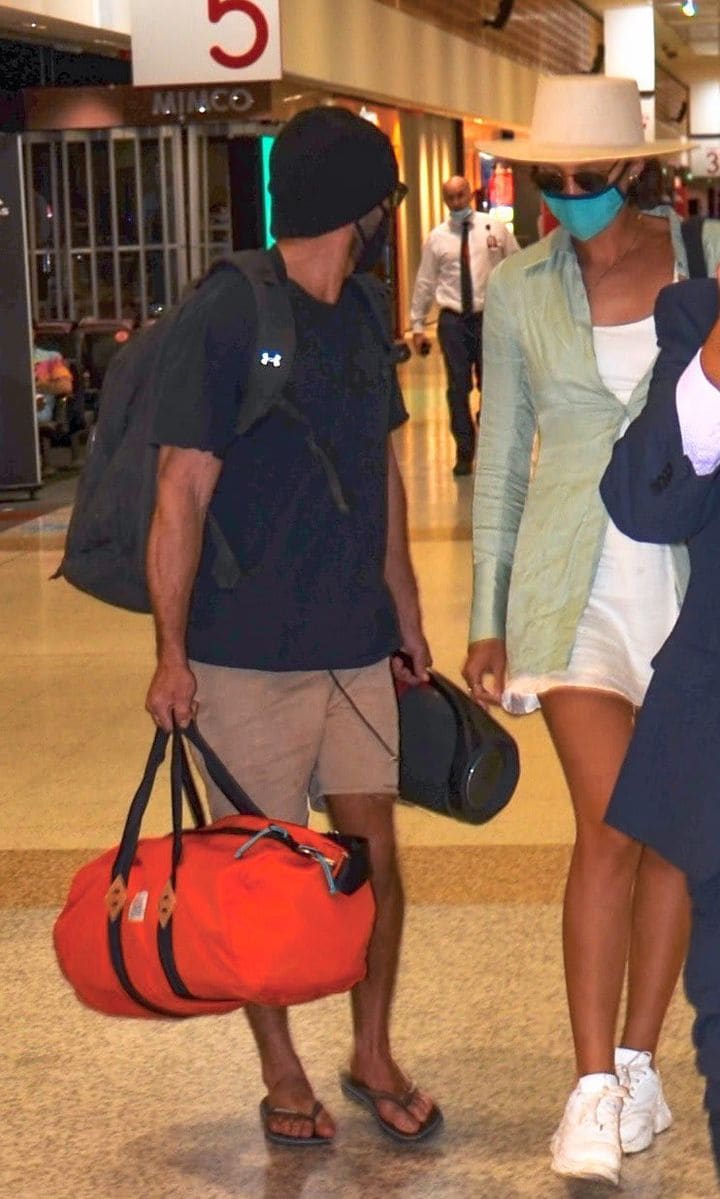 Zac Efron and Vanessa Valladares getting off a plane together