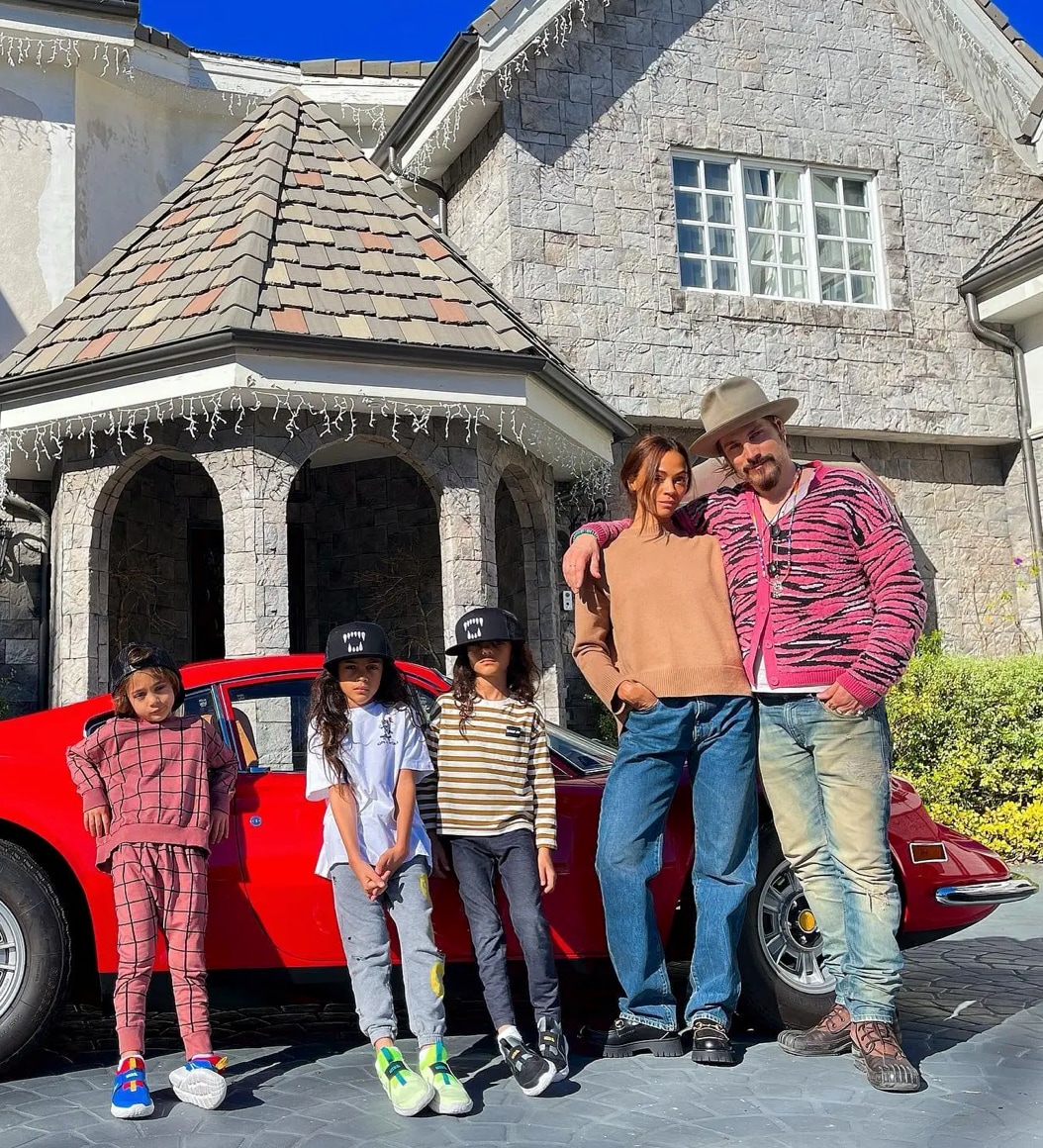 Zoe with her sons, 10-year-old twins Cy and Bowie, and 8-year-old Zen, whom she shares with husband Marco Perego-Saldaña. 