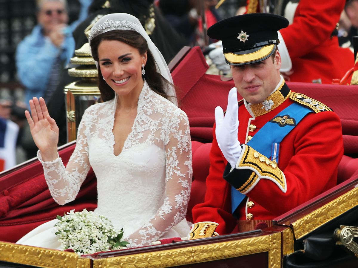 LONDON, ENGLAND - APRIL 29:  Their Royal Highnesses Prince William, Duke of Cambridge and Catherine, Duchess of Cambridge journey by carriage procession to Buckingham Palace following their marriage at Westminster Abbey on April 29, 2011 in London, England. The marriage of the second in line to the British throne was led by the Archbishop of Canterbury and was attended by 1900 guests, including foreign Royal family members and heads of state. Thousands of well-wishers from around the world have also flocked to London to witness the spectacle and pageantry of the Royal Wedding.  (Photo by Sean Gallup/Getty Images)