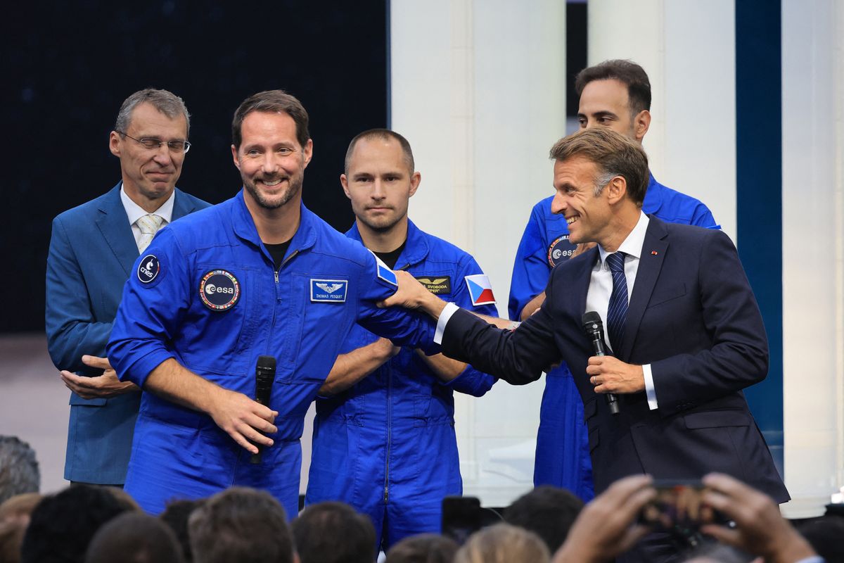 French President Emmanuel Macron shares a lighthearted moment with ESA astronaut Thomas Pesquet during the International Space Summit in Paris