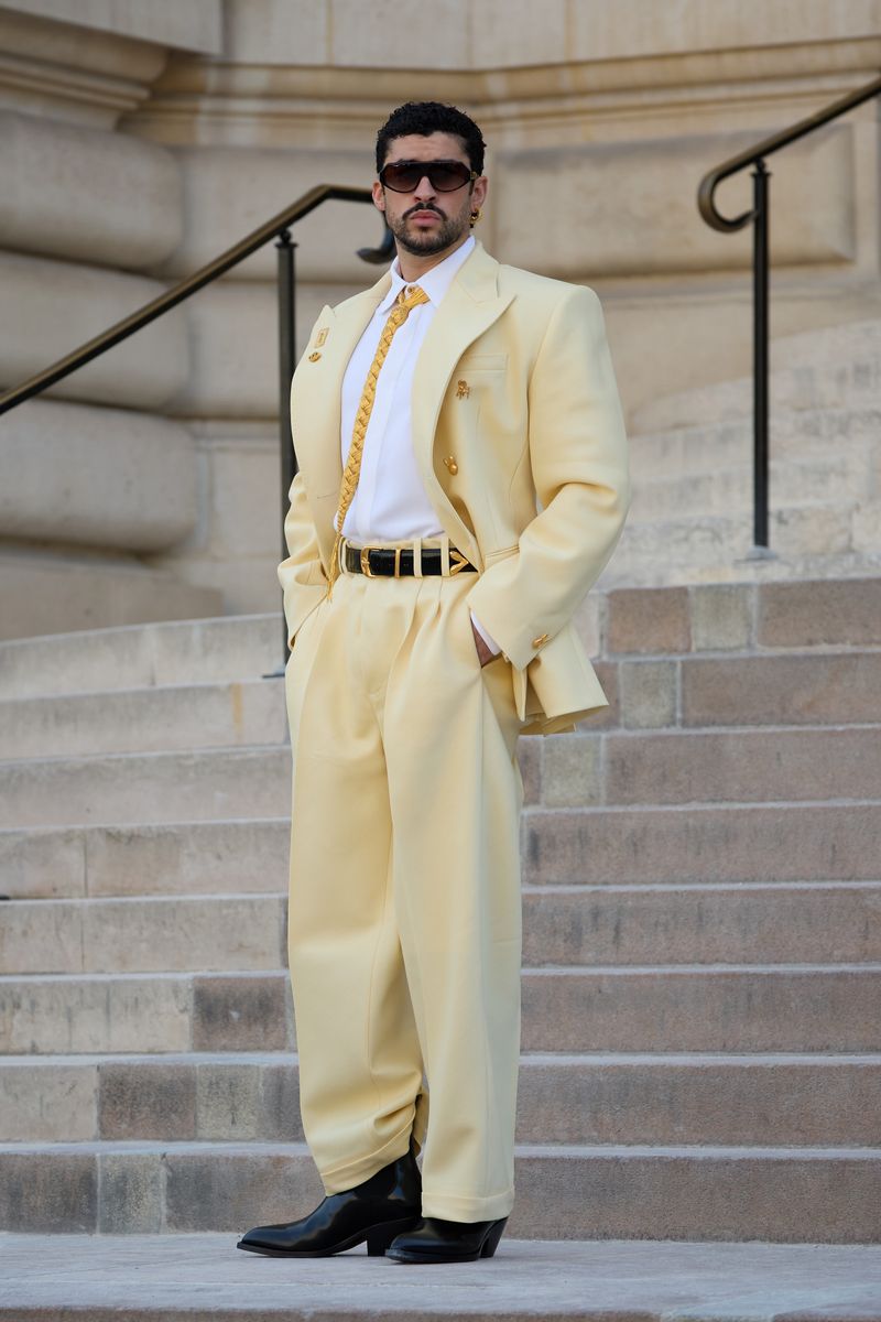 He completed the outfit with heeled black leather cowboy boots, a black leather belt, oversized Emmanuelle Khanh sunglasses