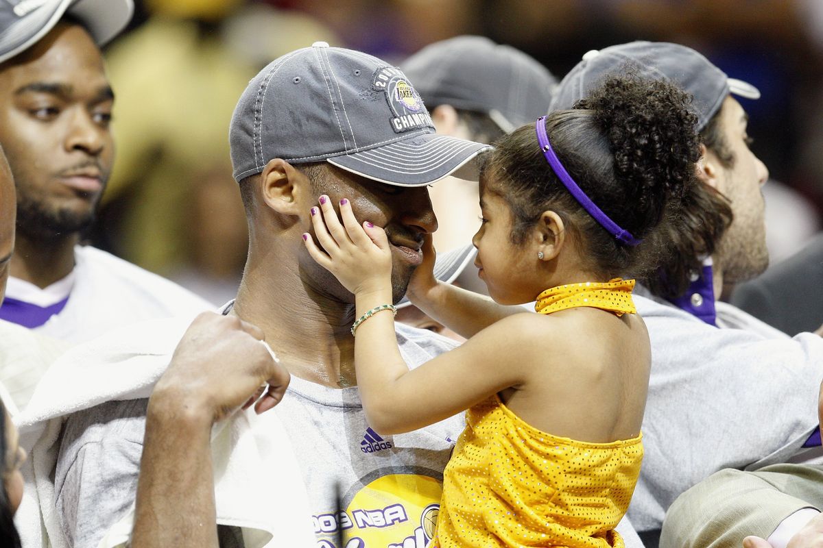 Kobe Bryant holds Gianna, after the Lakers defeated the Orlando Magic in Game Five of the 2009 NBA Finals on June 14, 2009 