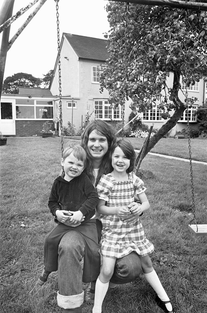 Ozzy Osbourne singer with the Heavy Metal band Black Sabbath seen here at home with his children Jessica and Louis, 19th August 1978. 