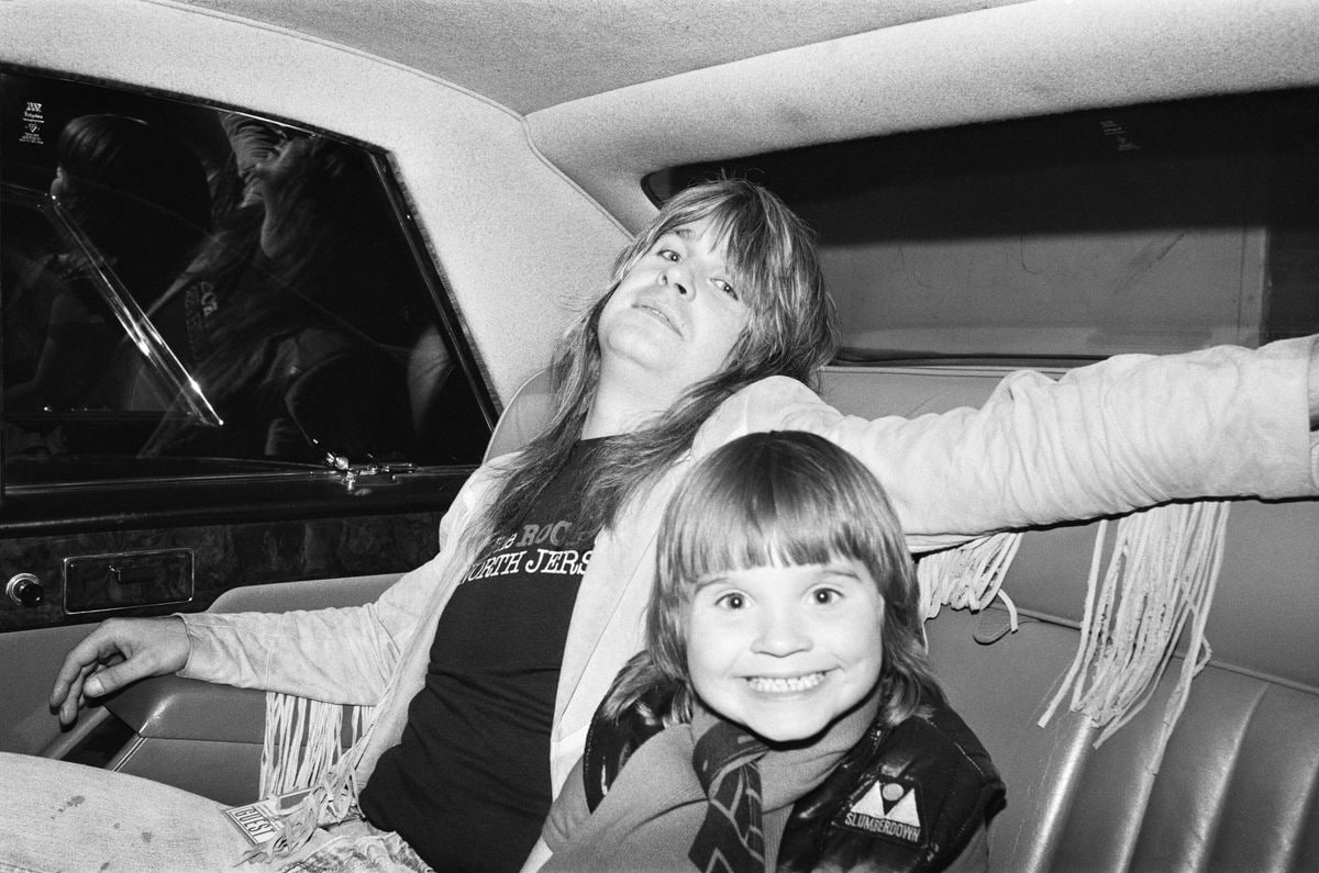 Lead singer Ozzy Osbourne, of Black Sabbath, pictured in a car with son Louis Osbourne. 3rd August 1981 