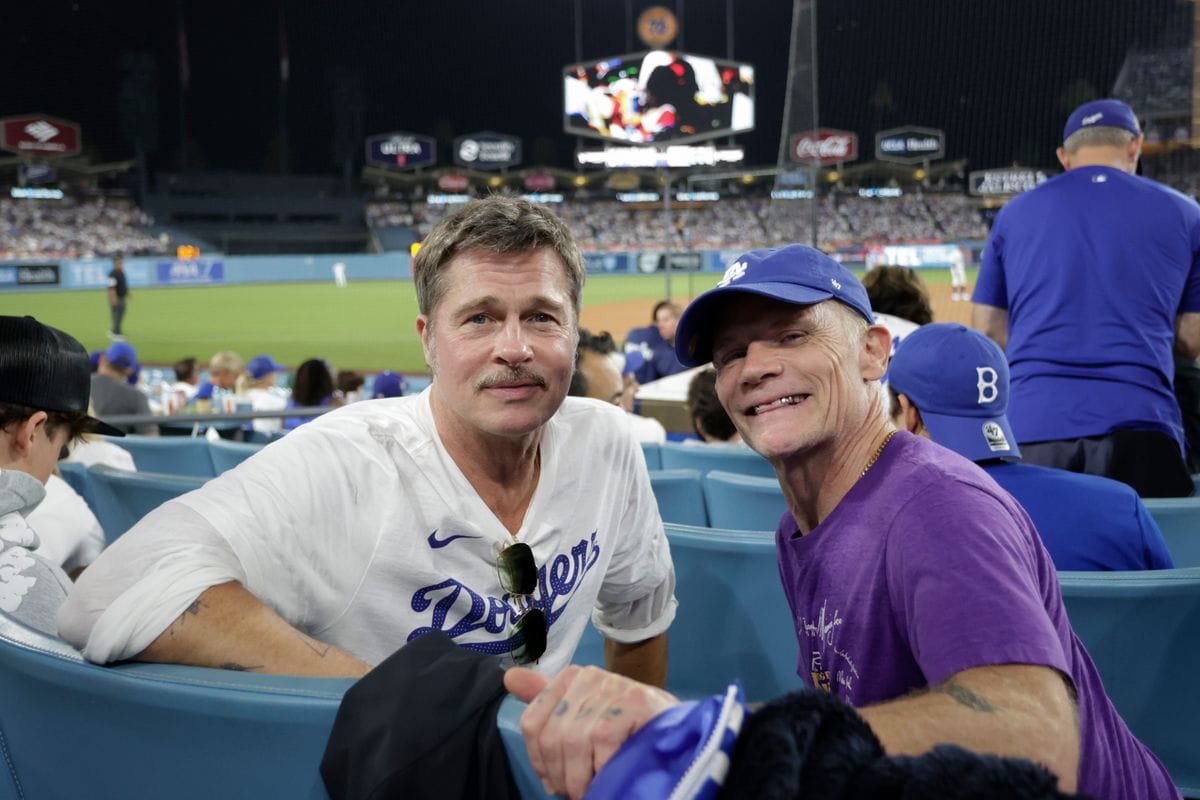 Brad Pitt and Flea pose for a photo