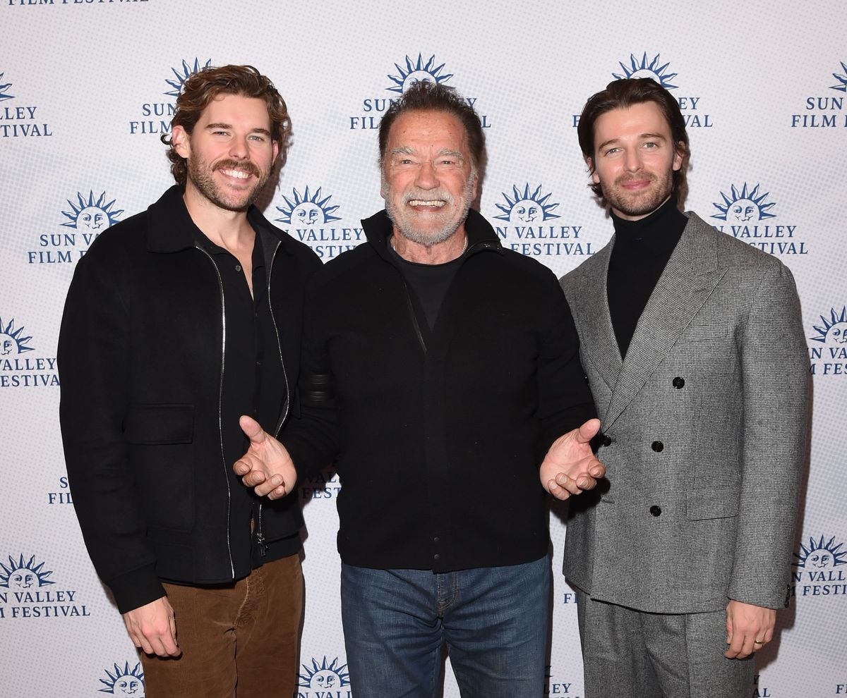 Arnold Schwarzenegger steps out for rare red carpet moment with sons Patrick and Christopher