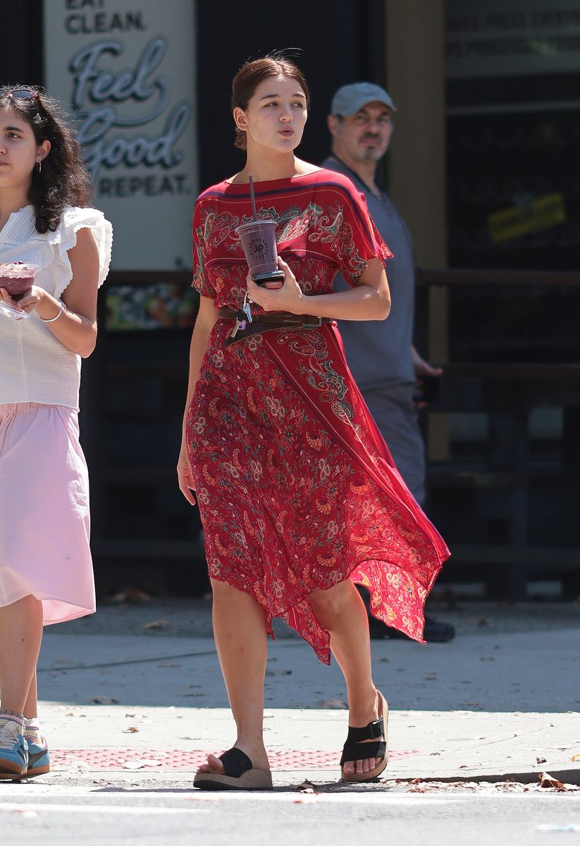 She paired the look with black platform sandals and smiled at the cameras during her outing.
